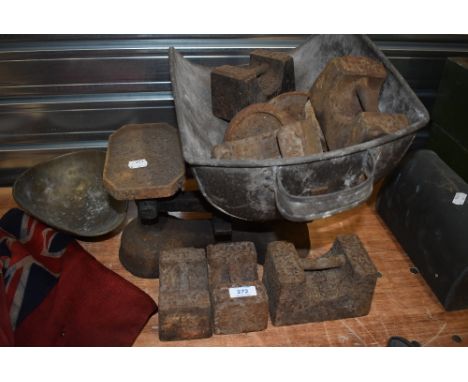 A set of vintage potato scales and a selection of weights.