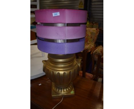 A large gilt effect table lamp