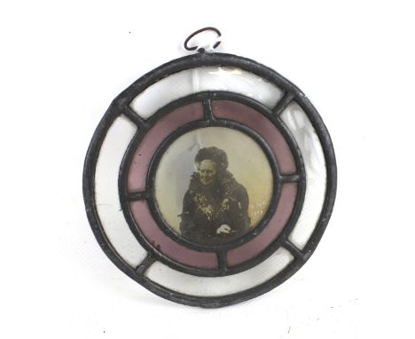 A 20th century leaded glass tondo. Featuring the portrait of an elderly woman, marked '9 Dec 1909', Diameter 15cm
