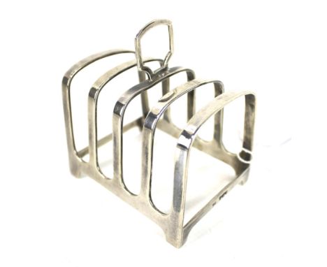 A silver oblong four division toast rack. With a central loop handle, mark of Walker & Hall, Sheffield 1954, 92g Condition Re