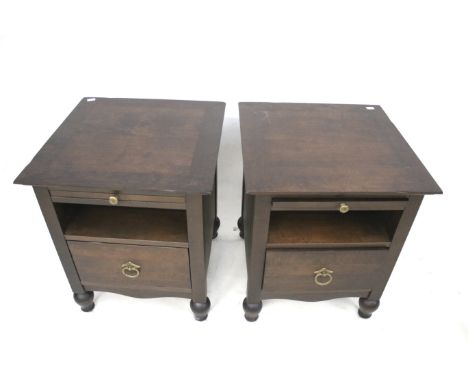 A pair of contemporary M&S bedside cabinets. Each with an open shelf and a single drawer, raised on turned supports, H60cm x 