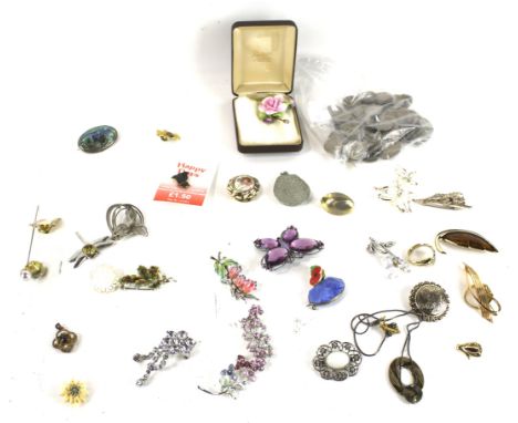 A collection of approximately 20 costume jewellery brooches mostly of flora and fauna. Including a purple-paste butterfly; a 