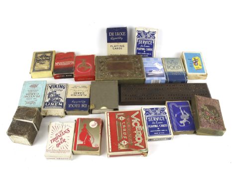 An assortment of vintage games. Including playing cards, a cribbage board, etc. the majority in the original boxes
