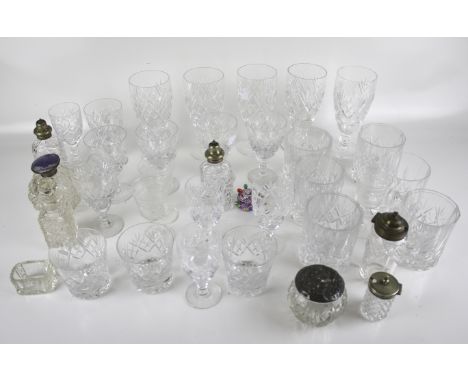 An assortment of glassware. Including a set of five Doulton glasses, an enamel topped scent bottle, cut glass beakers, etc.