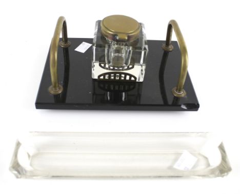 A vintage inkwell and pen tray. The glass ink pot of square form, mounted on a rectangular slate base with twin brass handles