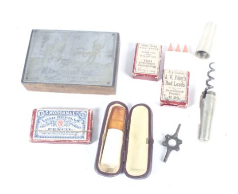 An assortment of collectables. Including a boxed cheroot holder with an amber mouthpiece, a corkscrew, a block print, etc.