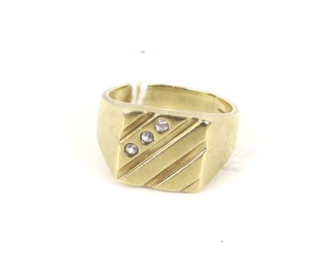 A modern 9ct gold and cubic zirconia three-stone square signet ring. The head with diagonal bands, hallmarks for Birmingham 2