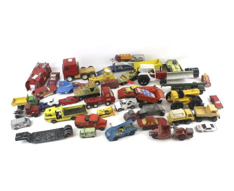 An assortment of playworn diecast vehicles. Including a Dinky Fire Engine, Matchbox Scammel Tractor, etc.