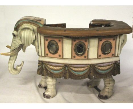 A vintage Indian carnival merry go round ride on elephant prop. Padded foam seat around the top, main structure of pine panel