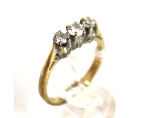 A vintage 9ct gold and diamond three stone ring. The graduated round brilliant diamonds approx. 0.25cts total, all claw set o