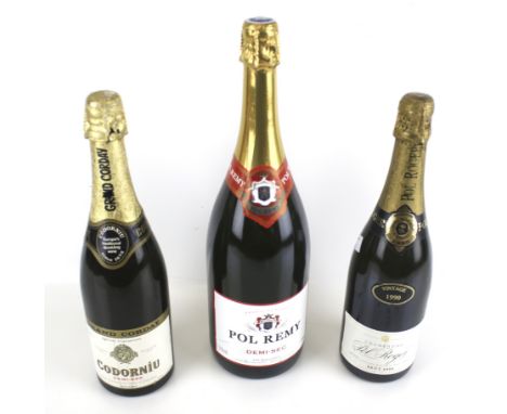 Three bottles of assorted sparkling wine. Including Pol Remy 1500ml, Pol Roger Champagne 1990, 750ml; Grand Corday Codorniu 7