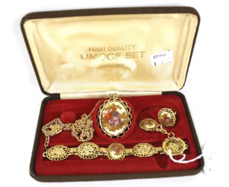 A set of gold-plated 'Limoges' jewellery. To include; a ring, a pendant and chain, a bracelet and a keyring, all in original 