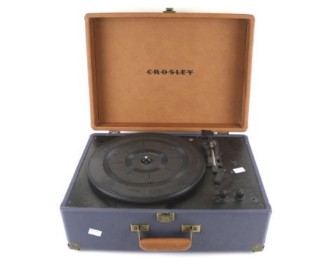 A contemporary Cosley retro record player. Within a blue and orange leatherette travelling case, L44cm