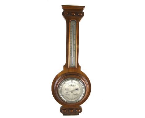 A 20th century banjo barometer. The mahogany case with carved details, with a thermometer positioned above, H59cm