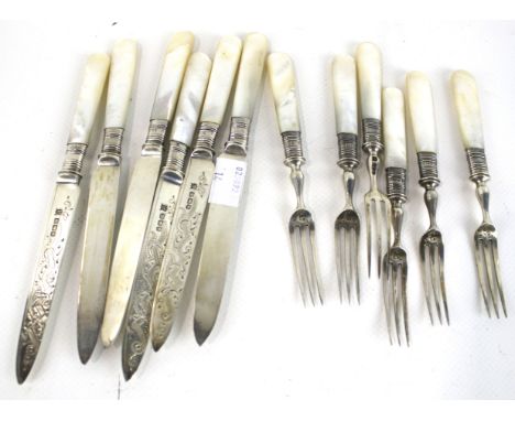 A set of six Edwardian silver and mother of pearl handled fruit knives and forks. The blades/tines/ferrules with the mark of 