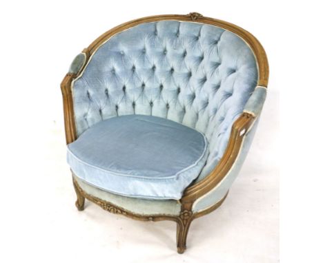 A 20th century button back tub chair. With a carved wooden frame, raised on cabriole supports, upholstered in blue velvet, H8