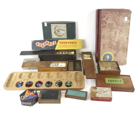 An assortment of vintage board games and accessories. Including dominoes, 'Fanorono' and Scrabble turntable, etc. 
