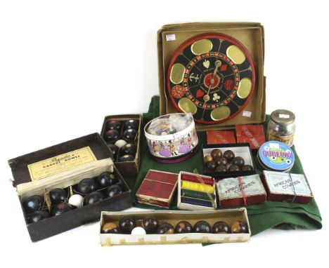A collection of assorted vintage games. Including table bowls, African Cowries, etc.