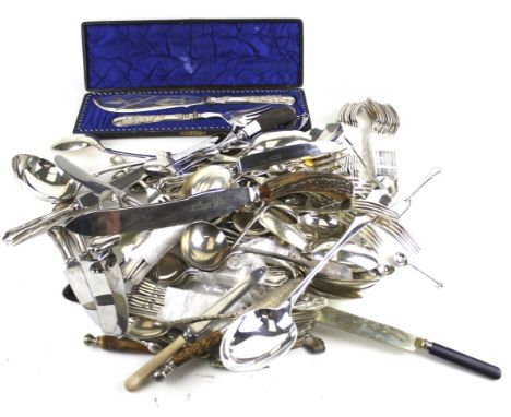 A collection of silver-plated flatware and serving items. Including a fiddle pattern soup ladle; a rat tail serving spoon; a 