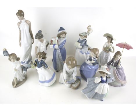 Eleven Nao figures. Including a child playing with a doll, a woman holding a basket, etc. Max. H31cm