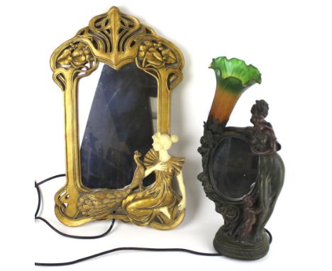 A contemporary Art Nouveau style lamp and mirror. The lamp modelled as a woman beside a child, with a coloured glass shade, H