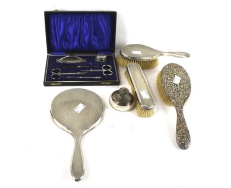 A silver mounted three piece dressing table set and other items; the engine turned dressing table set with hallmarks for Lond