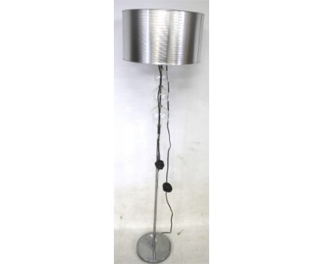 A contemporary chrome standard lamp. With ribbed silver shade, H130cm