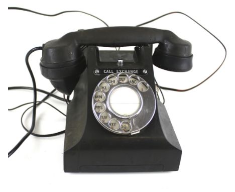 A vintage black bakelite telephone. Marked 'Call Exchange', H15cm