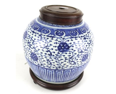 A Chinese 19th century ginger jar converted to a lamp base. On a wooden stand. H28cm