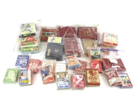 An assortment of vintage children's card games. Including 'Jaques Original Snap', 'Woodland Happy Families, etc. the majority