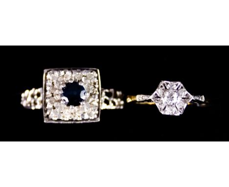 An 18ct Gold Diamond and Sapphire Ring, set with a centre sapphire, approximately .30ct, surrounded by small white stones,&nb