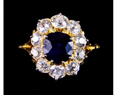 A Sapphire and Diamond Ring,&nbsp;set with a central natural sapphire, approximately 1.70ct, surrounded by brilliant cut whit