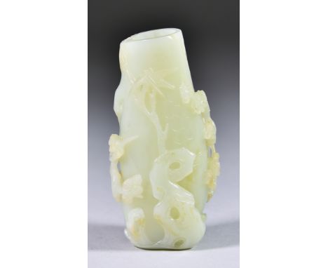 A Chinese Jade Vase,&nbsp;Qing 18th/19th Century, carved with rockwork, prunus and bamboo,&nbsp;4ins (10.1cm) highImages with