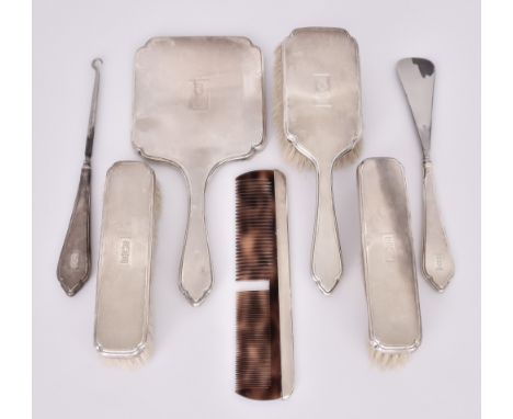 A George V Silver-Backed Seven-Piece Dressing Table Set and other Dressing Table Items, the seven-piece set by William Comyns