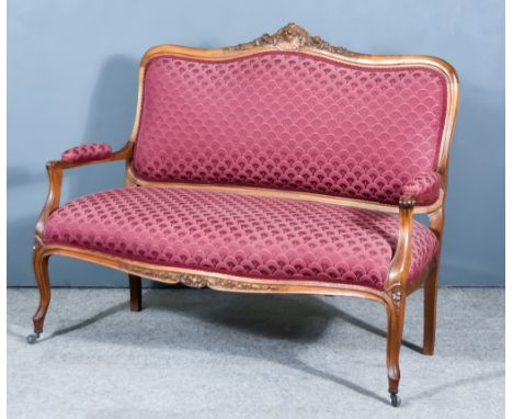 An Early 20th Century Beech Wood Settee of Louis XV Design, the shaped and moulded frame with scroll carved cresting, the sea