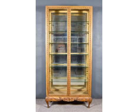 A 19th Century Parcel Gilt and Gesso Tall Display Cabinet, with square edge to top, fitted six plate glass adjustable shelves