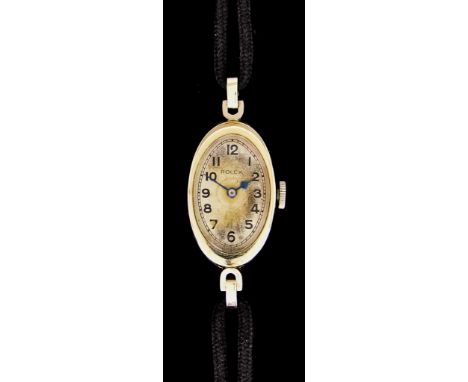 A&nbsp;Lady's&nbsp;18ct White Gold Manual Wind Wristwatch, by Rolex, case 24mm x 16mm, silvered dial with black Arabic baton 