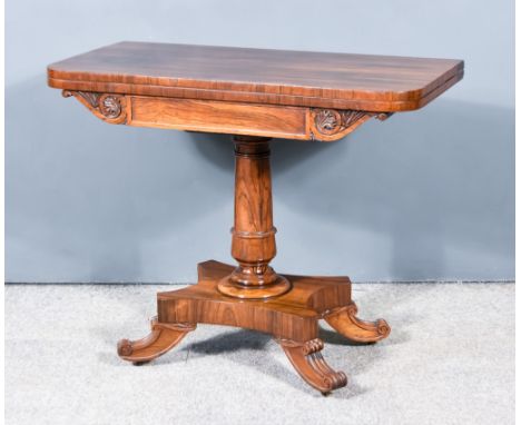 A William IV Rosewood Card Table, with green baize lined folding top, plain frieze flanked by leaf scroll carved supports, on