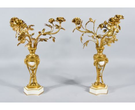 A Pair of Ormolu and White Marble Three-Light Candelabra, Late 19th Century, the Neo Classical urn-pattern column with three 