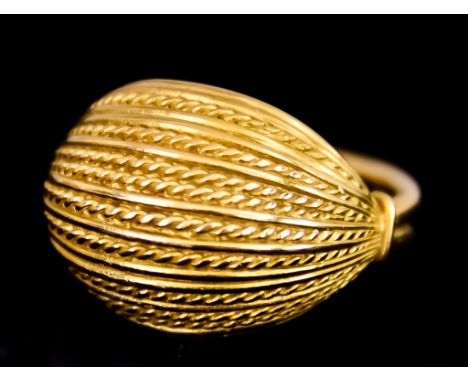 A Danish 18ct Gold Ring by Georg Jensen, stamped 863B, the domed face with rope and reed pattern weight 8.4gThe ring size is 