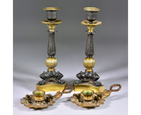 A Pair of Bronze Patinated Brass and Gilt Metal Candlesticks, of Neo Classical Form, cast with central column of acanthus ove