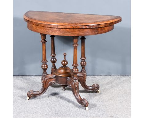 A Victorian Walnut D-Shaped Card Table, with moulded edge to top, the whole inlaid with satinwood and ebonised stringings, on