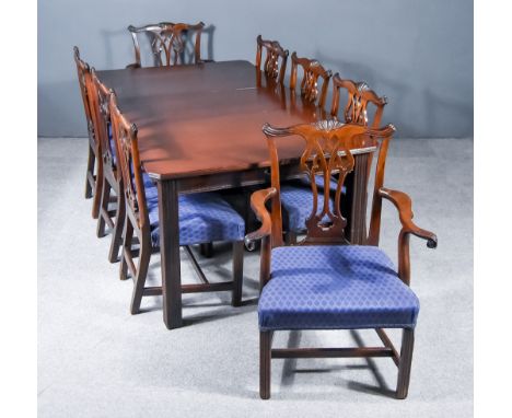 An Early 20th Century Mahogany Extending Dining Table of "Georgian" Design, with reeded edge and canted corners to top, plain