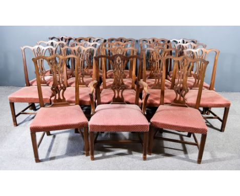 A Set of Eighteen Mahogany Dining Chairs, of "Chippendale" Design, each with shaped crest rails, vase pattern splats, the sea
