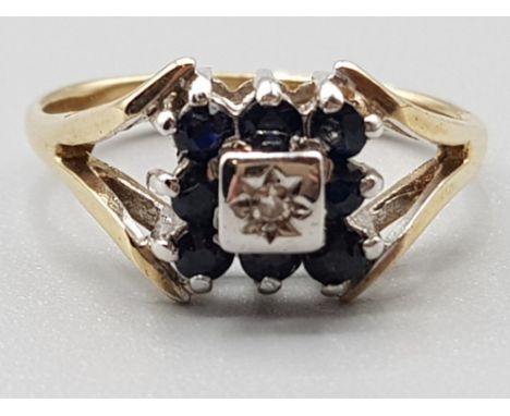 Ladies 9ct yellow gold square sapphire and diamond cluster ring featuring eight black sapphires size K 2.3g gross