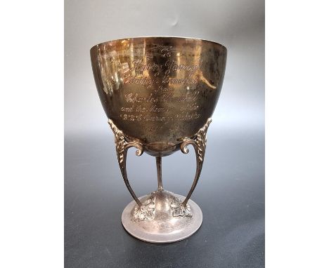 A silver footed bowl raised on three supports, by Hukin &amp; Heath, Birmingham 1913, 13cm high, 194g. 