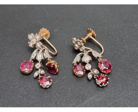 A pair of Belle Epoque ruby and mine cut diamond&nbsp;screw back pendant earrings, in a yellow metal and silver setting, 32mm