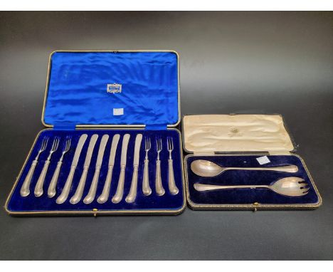 A cased pair of silver salad servers, by&nbsp;Thomas Bradbury &amp; Sons Ltd, Sheffield 1926, 98g; together with a cased set 