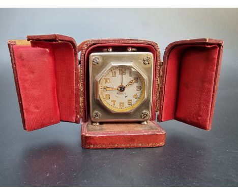 A vintage Reveil alarm clock, 5.5cm high; together with a vintage Oriosa manual wind wristwatch, 32mm. 