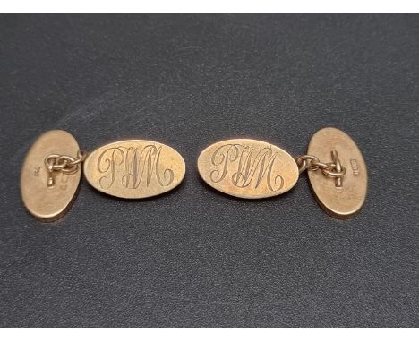 A pair of 9ct gold cufflinks, engraved initials to one panel, with chain interconnectors, the panels 19 x 11mm, 16.4g. 